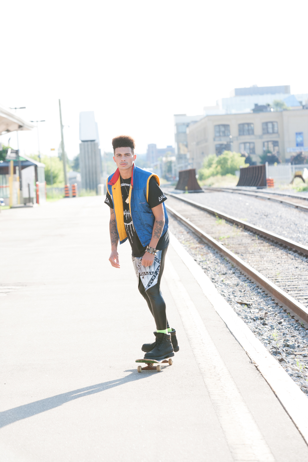 Brandon is killing it on the skateboard! He's wearing an original BMW Racer vest with an Evolve and Rebel tee. He is really the only guy I know that can get away with wearing those slick leggings too!